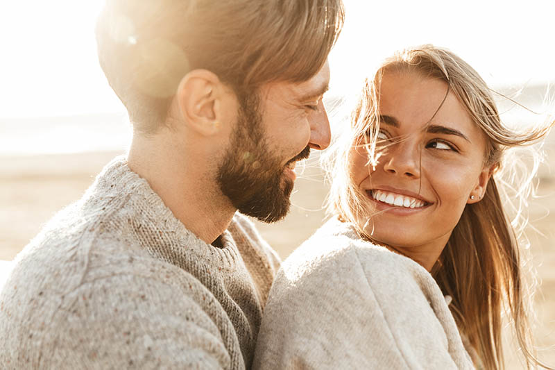 Young couple smiling at eachother